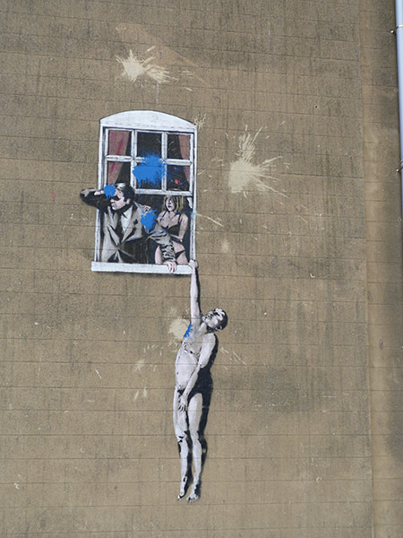 Banksy Naked Man Hanging From Window